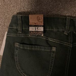 size 15 ladies Stylish blue jeans with raw edges at ankles. Never won.  tags on.